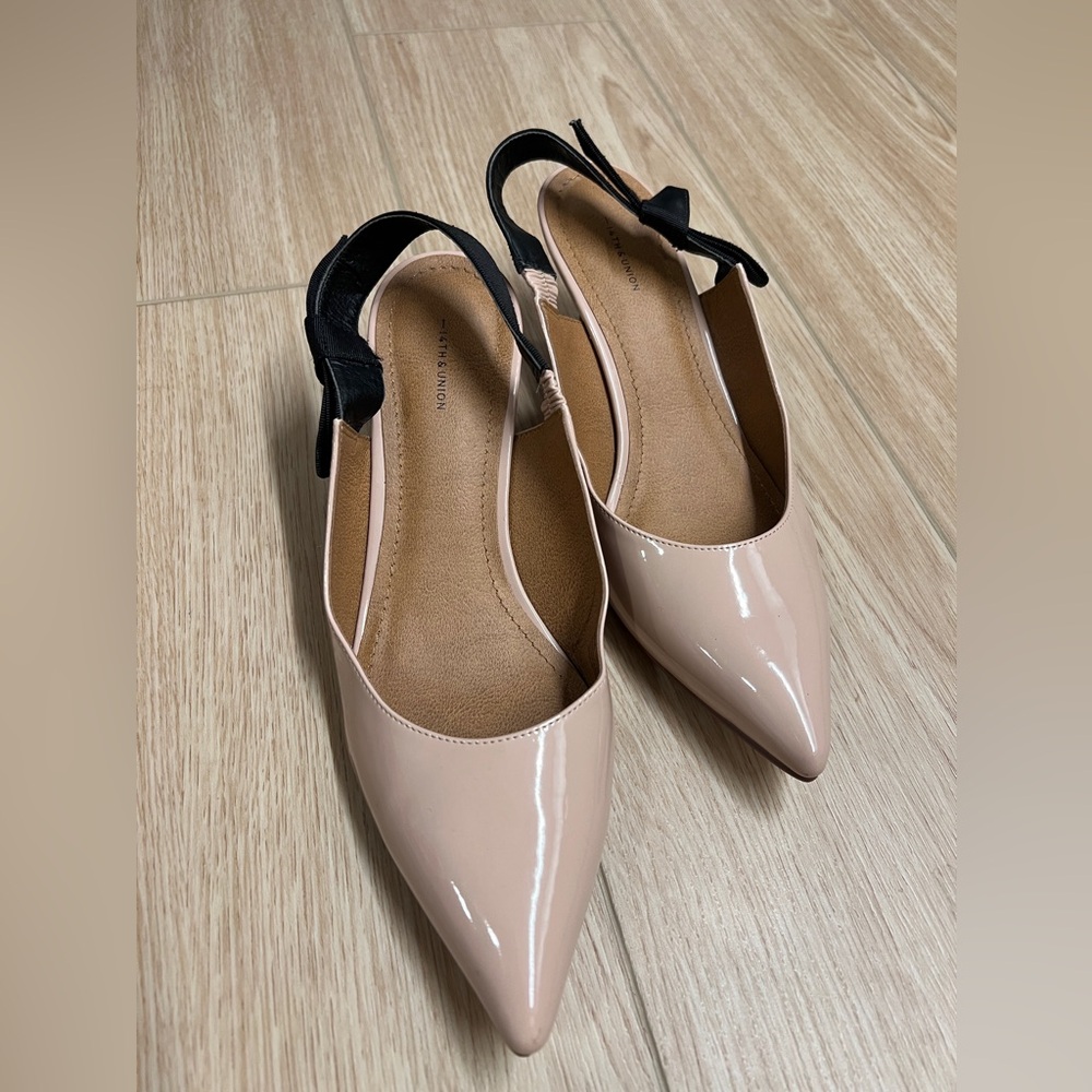 Nude and black kitten heel shoes